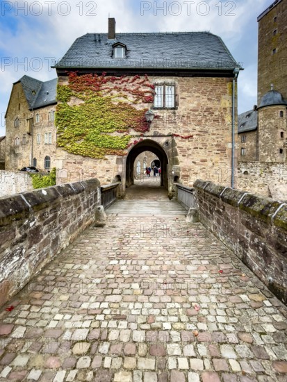 Front access with historic bridge over moat Hirschgraben to gatehouse of Steinau Castle, Steinau an der Straße, Hesse, Germany