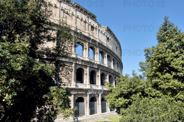 Partially restored façade of the exterior façade of the Roman Colosseum from antiquity, west side, Rome, Lazio, Italy