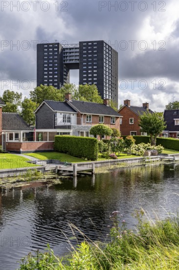 Tasmantoren residential tower block in the Oosterhogebrug district in the city of Groningen, 75 metres high with 218 flats on 23 floors, residential buildings on Rijksweg on the Damsterdiep canal, Netherlands
