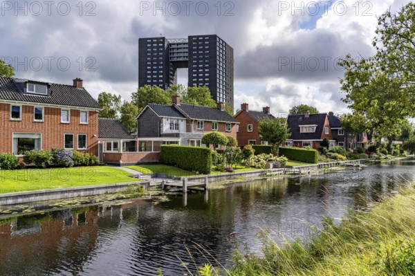 Tasmantoren residential tower block in the Oosterhogebrug district in the city of Groningen, 75 metres high with 218 flats on 23 floors, residential buildings on Rijksweg on the Damsterdiep canal, Netherlands