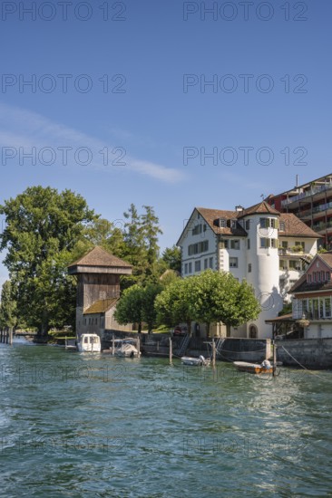 The banks of the Rhine in Diessenhofen with the historic wooden Hänkiturm tower, Canton Thurgau, Switzerland