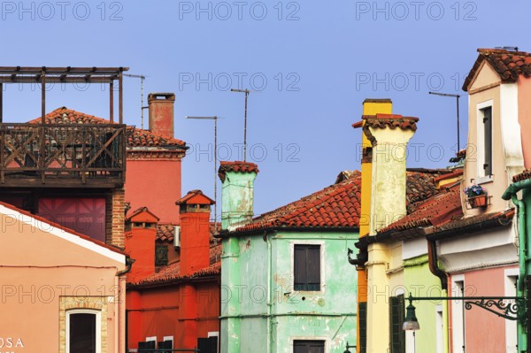 Typical Venetian chimneys, colourful façade details, Burano, Venice, Veneto, Italy
