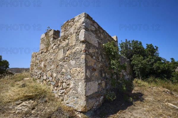 Old stone ruins with surrounding vegetation under a clear blue sky, Panagia tou Paleokastro, Church of the Old Fortress, Chapel, Panagia Kasteli, Lepides, Leros, Dodecanese, Greek Islands, Greece