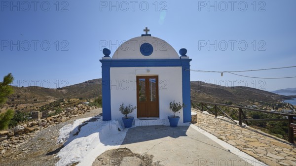 White and blue chapel in a rural area with views of the sea and surrounding hills, Panagia tou Paleokastro, Church of the Old Fortress, Chapel, Panagia Kasteli, Lepides, Leros, Dodecanese, Greek Islands, Greece