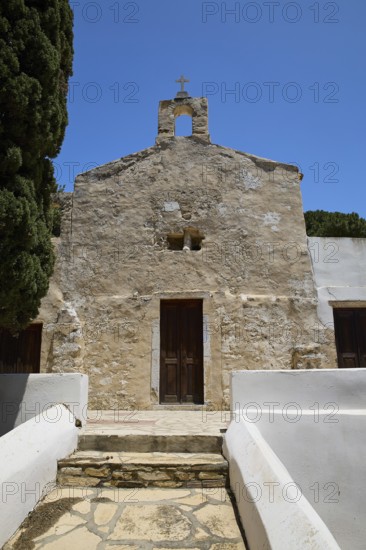 Symmetrical view of a stone church entrance with steeple, Basilica, Church, Agios Theologos, Leros, Dodecanese, Greek Islands, Greece