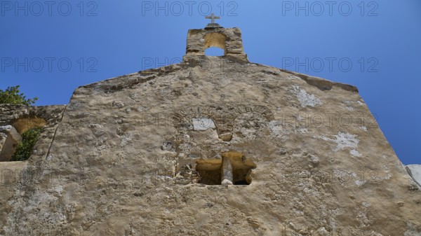 Detail of a stone church façade with architectural elements and steeple, Basilica, Church, Agios Theologos, Leros, Dodecanese, Greek Islands, Greece