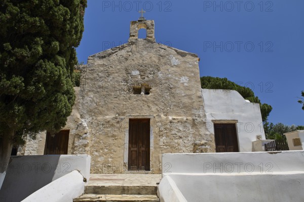 Stone church façade with steeple, rustic entrance, clear sky, basilica, church, Agios Theologos, Leros, Dodecanese, Greek Islands, Greece