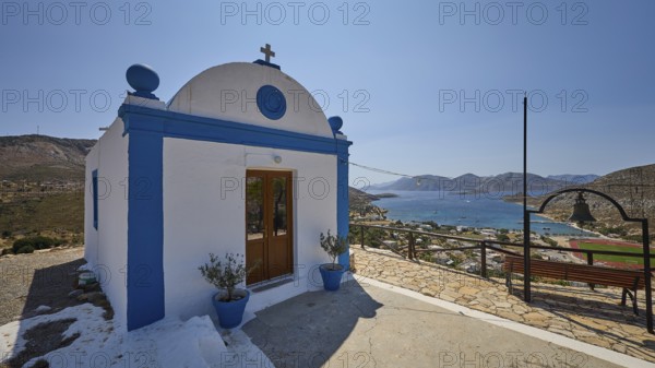 White-blue chapel with a view of a hilly landscape and the sea in the background, Panagia tou Paleokastro, Church of the Old Fortress, Chapel, Panagia Kasteli, Lepides, Leros, Dodecanese, Greek Islands, Greece