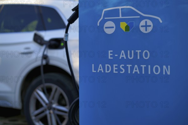 Charging station, charging station, Stadtwerke Stuttgart for electric cars, charging station, e-fuelling station, e-mobility, charging cable leads into e-car, logo, Stuttgart, Baden-Württemberg, Germany