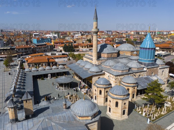 Historic mosque with large domes and minarets in the city centre under a clear sky, aerial view, Mevlânâ Museum, Mevlana, landmark, Mausoleum of Mevlânâ Dschalal ad-Din Rumi, Konya, Central Anatolia, Turkey
