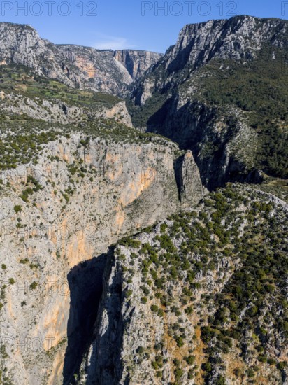 Majestic rock formations surrounded by green terrain and clear skies, aerial view, Saklikent Gorge, Saklikent, Saklikent National Park, Antalya Province, Turkey