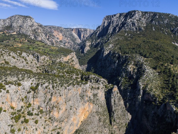 Deep gorge with imposing rocks and green vegetation under a clear blue sky, aerial view, Saklikent Gorge, Saklikent, Saklikent National Park, Antalya Province, Turkey