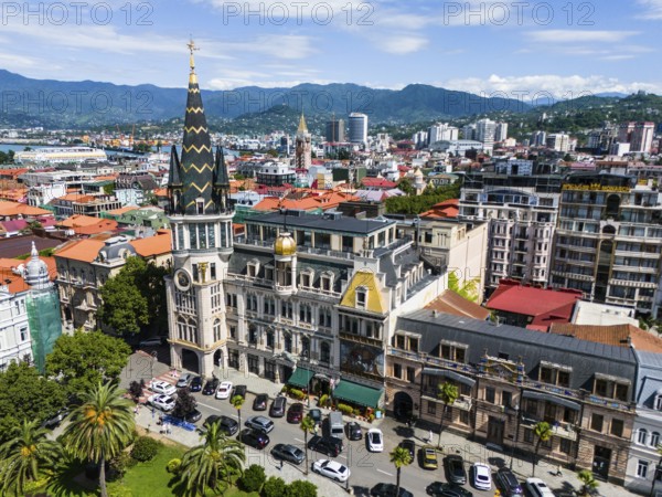 City view with impressive, historically inspired buildings in front of a mountain panorama, aerial view, astronomical clock, Black-Gold-Roof, Europe Square, Batumi, Black Sea, Adjara region, Adjara, autonomous republic, Georgia