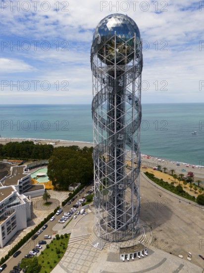 Modern tower by the sea with a view of the coast and the beach under a blue sky, aerial view, Alphabetic Tower, Tower of the Georgian Alphabet, Miracle Park, Batumi, Black Sea, Adjara region, Adjara, Autonomous Republic, Georgia
