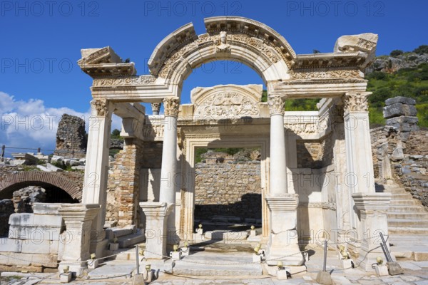Ancient ruins with an ornate arch and columns against a blue sky, Hadrian's Temple, Efes, Ephesus, Ephesus, UNESCO World Heritage Site, Izmir Province, Ionia, Turkey