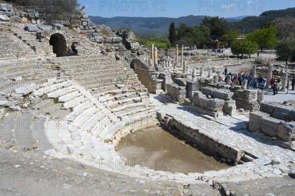 Ancient stone amphitheatre with steps surrounded by ruins in a historical site, theatre, Efes, Ephesus, Ephesus, UNESCO World Heritage Site, Izmir Province, Ionia, Turkey