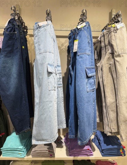 Jeans display at Zudio store in Guwahati, India, during a monsoon season sale on August 1, 2025