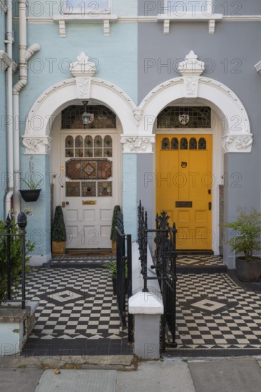 Victorian house entrances with coloured doors and decorative tiles, Kensington, London, England, Great Britain