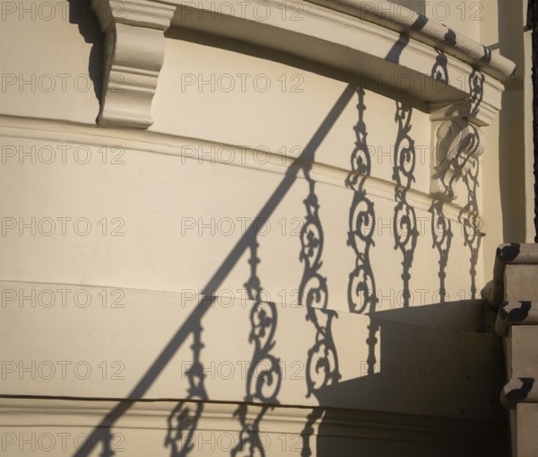Shadow of an artistically decorated banister on a house wall, Notting Hill, London, England, Great Britain