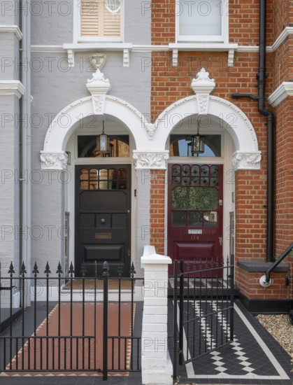 Victorian entrances, black and burgundy doors, black and white tile pattern, Kensington, London, England, Great Britain