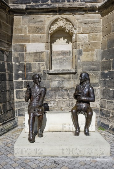 Bronze figures of Heinrich Schütz and Friedrich von Hardenberg alias Novalis by the artists Grit Bergner and Steffen Ahrens at the Protestant late Gothic St. Mary's Church, town church, market square, Weißenfels, Saxony-Anhalt, Germany