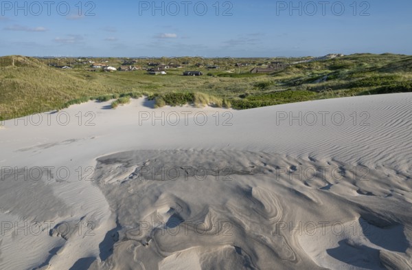 Dunes with beach grass, wave pattern in the sand, holiday settlement, blue sky, Hvide Sande, North Sea, Denmark