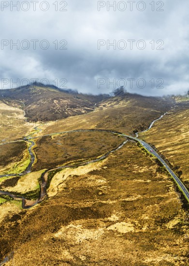Panorama of Eas a' Bhradain Waterfall from drone, Red Cuillin mountains, Loch Ainort, Isle of Skye, Scotland, UK