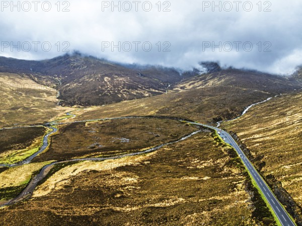 Eas a' Bhradain Waterfall from drone, Red Cuillin mountains, Loch Ainort, Isle of Skye, Scotland, UK