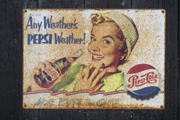 Retro Pepsi advertising sign with smiling woman and nostalgic design, Ringkøbing, Ringkøbing Fjord, Denmark