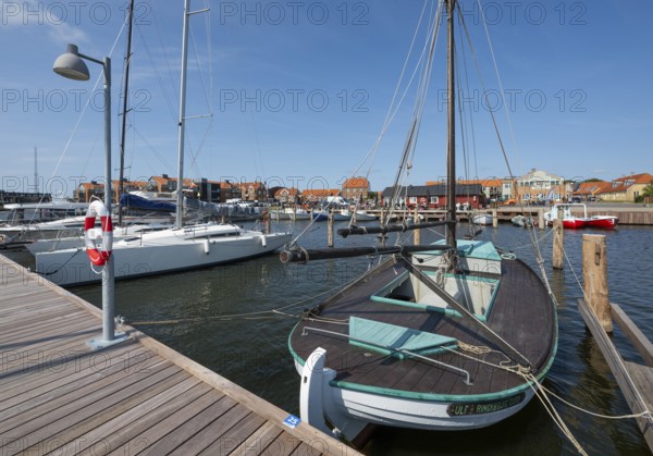 Old sailing boat in the harbour at a jetty, Ringkøbing, Ringkøbing Fjord, Denmark