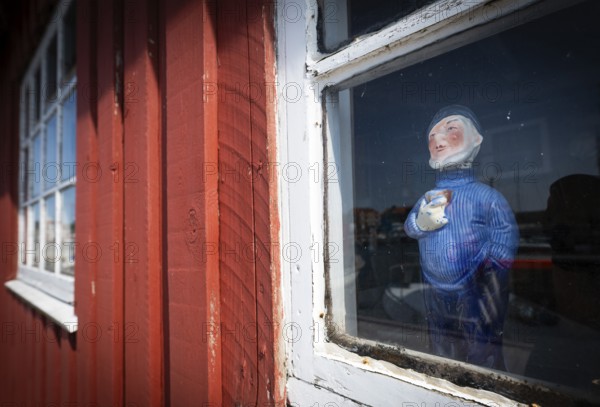Sailor doll standing behind the window of a red wooden house, harbour, Ringkøbing, Ringkøbing Fjord, Denmark