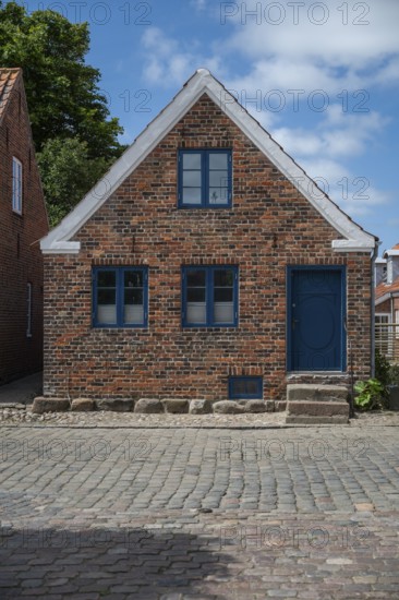 A traditional brick house with a blue door and blue windows, Old Town, Ringkøbing, Ringkøbing Fjord, Denmark