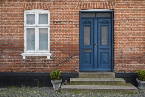Brick façade with a striking blue door, Old Town, Ringkøbing, Ringkøbing Fjord, Denmark