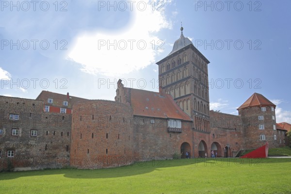Historic customs officers' tower, customs officers' house, castle gate and coal tower part of the former city fortifications, city gate, sculpture Cubecrack, Abstract Art, Modern Art, Brick Gothic, Brick buildings, City wall, Old Town, Lübeck, Schleswig-Holstein, Germany