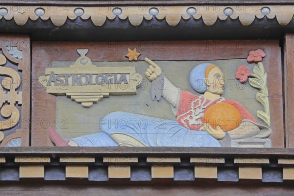 Allegorical woodcarving with figure on astrology with stars and planets, Renaissance, allegory, symbol, handicraft, art, historical painting, Latin inscription, detail, decoration, Wedekindhaus, Sparkasse, market square, Hildesheim, Lower Saxony, Germany