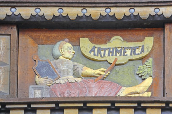 Allegorical woodcarving with figure on Arithmetica, Greek work with algebra, arithmetic, mathematics, calculating, Renaissance, allegory, symbol, arts and crafts, art, historical painting, Latin inscription, detail, decoration, Wedekindhaus, Sparkasse, market square, Hildesheim, Lower Saxony, Germany