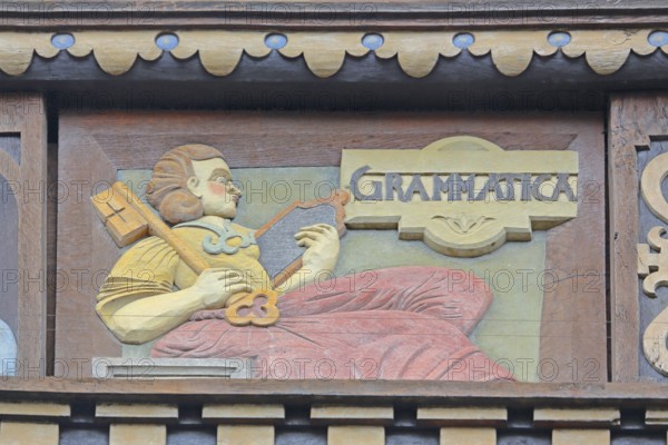 Allegorical woodcarving with figure grammar, key, plaque, spelling, linguistics, language, Renaissance, allegory, symbol, craftsmanship, art, historical painting, Latin inscription, detail, decoration, Wedekindhaus, Sparkasse, market square, Hildesheim, Lower Saxony, Germany