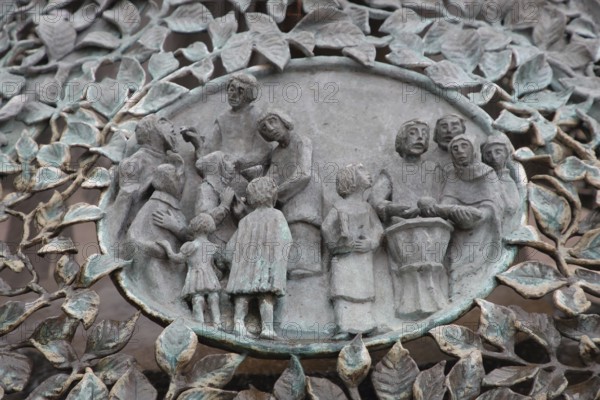 Bugenhagen Fountain by Ulrich Henn 1995 with Baptism and Holy Communion, congregation, people, hand out figures, sacrament, symbol, sculpture, modern art, bronze sculpture, relief, Andreasplatz, Hildesheim, Lower Saxony, Germany