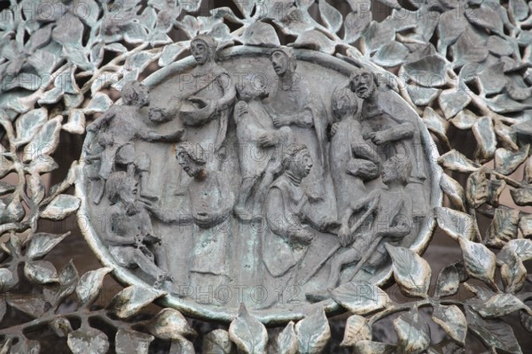 Bugenhagen Fountain by Ulrich Henn 1995 with Baptism and Holy Communion, parish, people, hand out figures, sacrament, symbol, sculpture, modern art, bronze sculpture, relief, Andreasplatz, Hildesheim, Lower Saxony, Germany