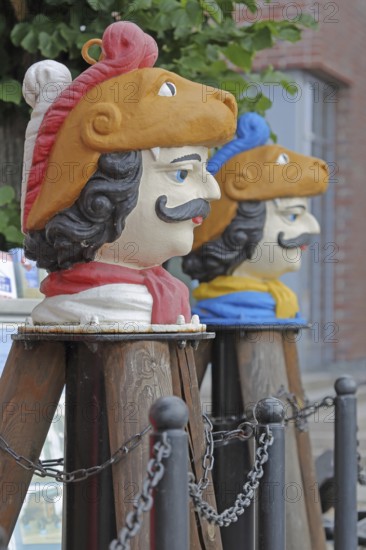 Colourful Swedish heads as landmarks, historical wooden head with face and four eyes, Swedish head tree house, Old Harbour, Wismar, Mecklenburg-Western Pomerania, Germany
