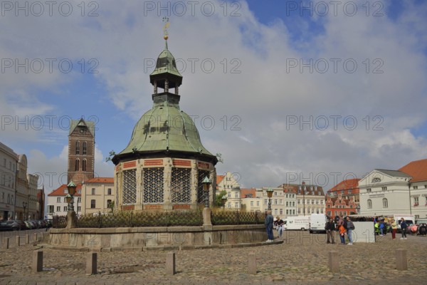 Renaissance water art with dome and St Mary's Church tower, landmark, market square, Wismar, Mecklenburg-Western Pomerania, Germany