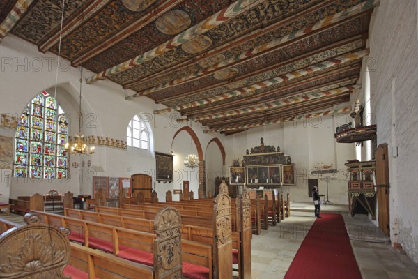 Interior view of the Church of the Holy Spirit with painted wooden ceiling, pulpit, winged altar and colourful stained glass window, arts and crafts, painting, decorations, wooden beams, Wismar, Mecklenburg-Vorpommern, Germany