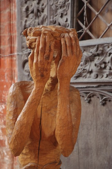 Wooden figure with hands in front of the face, interior view, wooden sculpture, modern art, wood carving, handicraft, life-size, arms, head, nothing, see, no, privacy, protect, protected, hide, hidden, fear, emotion, St. Nikolai, Wismar, Mecklenburg-Vorpommern, Germany