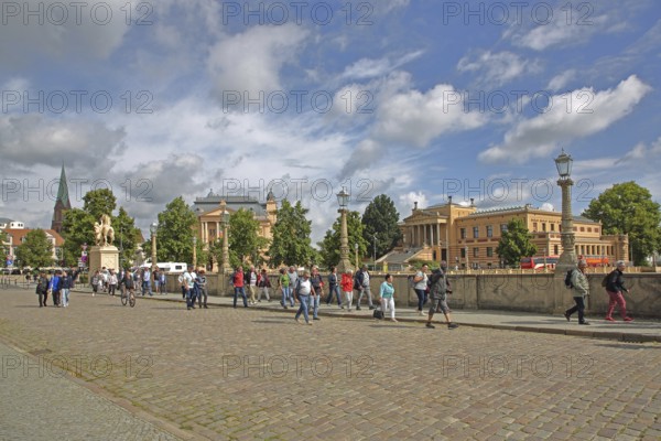 Castle bridge with stream of visitors to the castle and state museum, group of tourists, pedestrians, tourism, entrance, Schwerin, Mecklenburg-Vorpommern, Germany