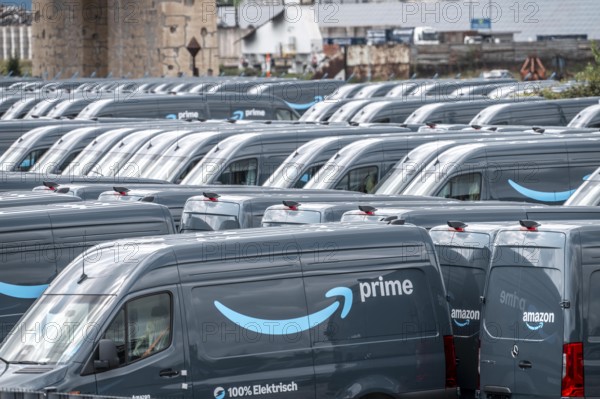 New delivery vehicles for the online mail order company Amazon Prime, with electric drive, are waiting for delivery in the inland port of Duisburg, Duisport, North Rhine-Westphalia, Germany