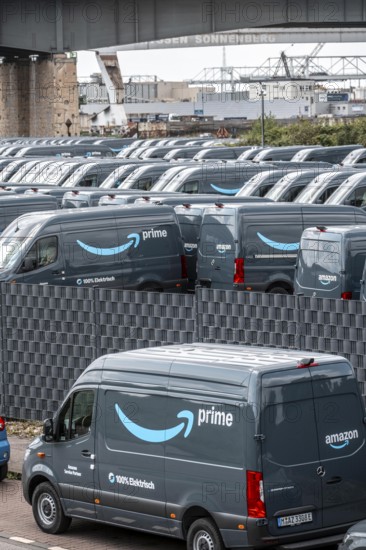 New delivery vehicles for the online mail order company Amazon Prime, with electric drive, are waiting for delivery in the inland port of Duisburg, Duisport, North Rhine-Westphalia, Germany