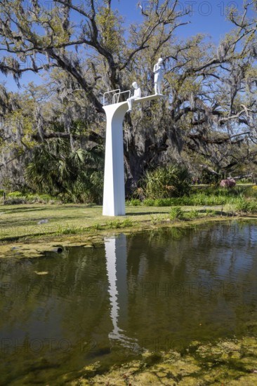 New Orleans, Louisiana - The sculpture garden at the New Orleans Museum of Art in City Park. Maybe (Not) is a sculpture by Michael Elmgreen and Ingar Dragset