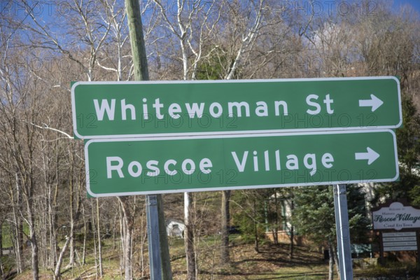 Coshocton, Ohio - A sign points to Whitewoman Street in Historic Roscoe Village. Whitewoman Street is named after Mary Harris, who in the late 1740s was the first white woman settler in this area. The city council has rejected proposals to change the street name