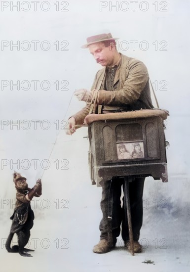 Organ grinder. Organ grinder, with a small monkey, around 1900, Historic, digitally restored reproduction from a 19th century original, Record date not stated