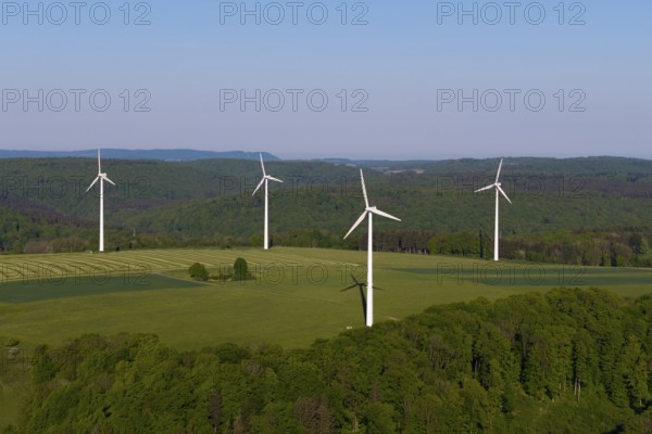Landscape with wind turbines and green fields under a blue sky, near Westerheim, Swabian Alb, Baden-Württemberg, Germany
